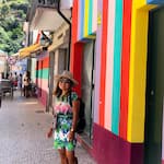 Cherine's standing in front of colorful buildings